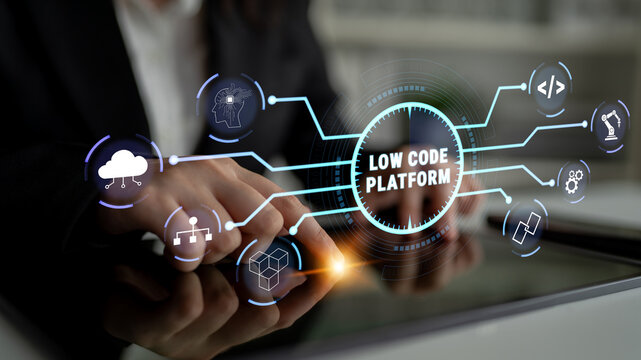 Hands Using Digital Tablet Displaying Low Code Platform Concept with Symbols of Technology and Innovation in a Modern Business Setting Quark.