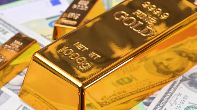 featuring US dollar and euro banknotes and gold bars.