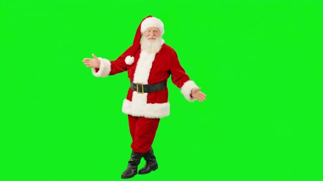 Cheerful Santa Claus dancing and moving to music isolated on a solid green screen background