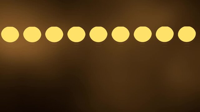 Warm Amber Light Orbs Drifting in a Row on a Dark Backdrop