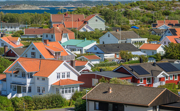 Traditional Swedish coastal neighborhood with colorful tiled roof houses.