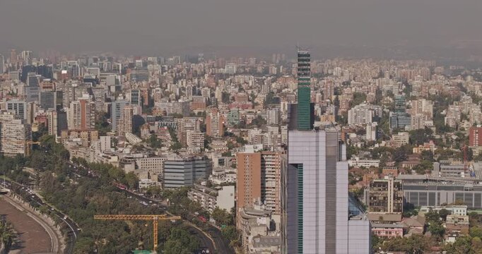 Santiago Chile Aerial v51 zoomed flyover around Torre Telefonica capturing rugged hills, park along Mapocho river and dense urban landscape - Shot with 5k Camera - Jan 24th 2025