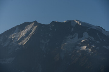 Obraz premium Summer view of the Mont Blanc massif above forested slopes 