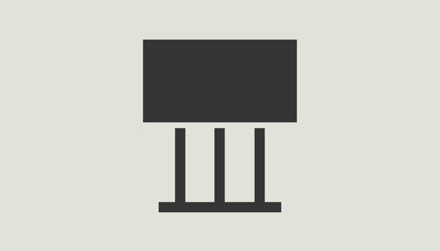Minimalist dark grey vector icon of a modern desk lamp with a rectangular shade and three vertical support pillars.