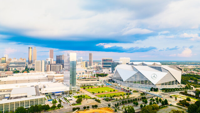 Mercedes-Benz Stadium and surrounding downtown Atlanta skyline viewed from an elevated aerial perspective.