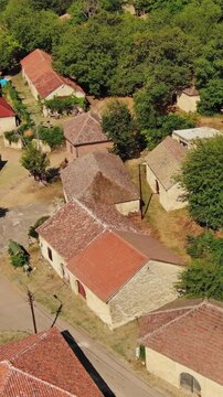 Aerial around view of old rustic vintage houses with wine cellars in Rogljevacke pivnice in Negotin region of Serbia. Vertical video 4k