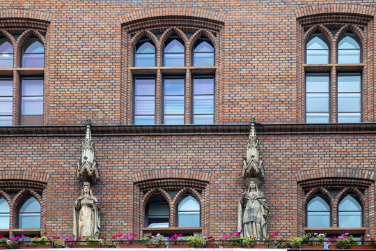 Berlin, Germany The historic red brick facade of the St. Hedwig Hospital main building in Mitte. The detailed Neo-Gothic architecture, 
