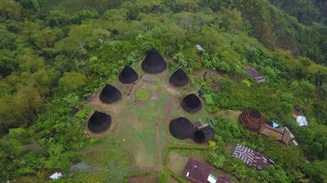 Bird's eye view of circular cone shaped traditional houses at Wae Rebo Manggarai Flores
