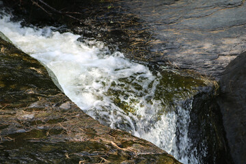 Chute of whitewater sliding down a rock face © Marisa