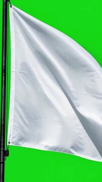 Realistic white fabric flag waving smoothly against a bright green screen background for easy keying and composting