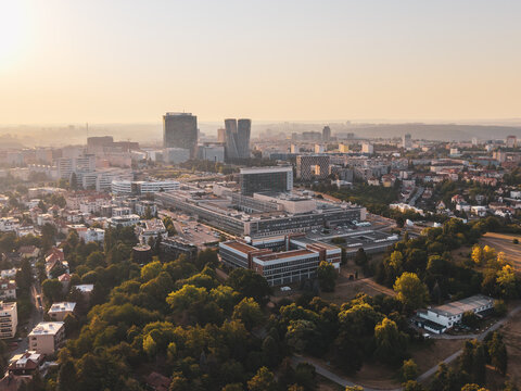 Aerial view of the Czech Television headquarters complex surrounded by urban greenery and residential buildings in Prague, Prague, Czechia.