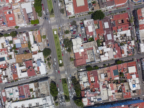 Aerial view of the historic Centro district with dense urban grid, terracotta rooftops, and busy streets in Guadalajara, Jalisco, Mexico.