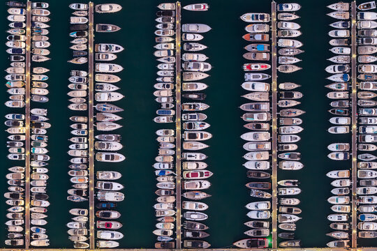 Aerial view of numerous yachts and boats docked in neat rows at the marina in Antibes, Provence-Alpes-Cote d'Azur, France.