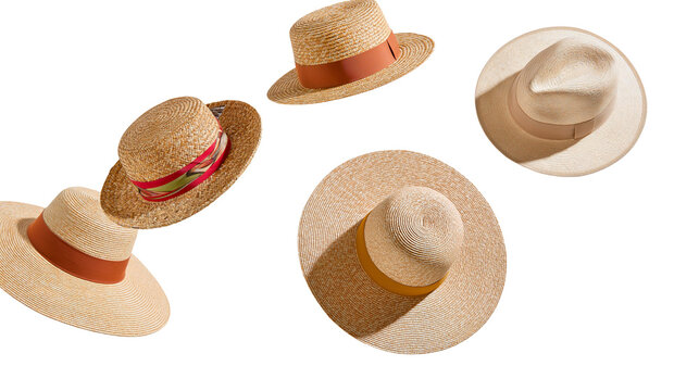 Isolated collection of various stylish straw hats for summer fashion and beach vacation.