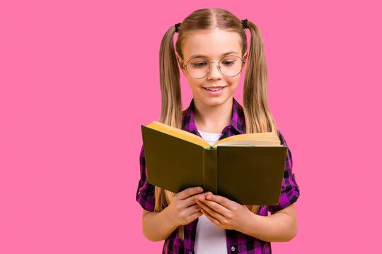 Closeup photo of small lady knowledge wondered reading story wear specs checkered shirt isolated bright yellow background