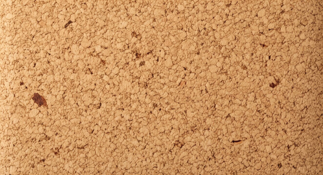 Cork texture background surface featuring detailed brown natural material pattern with rough granular porous structure for graphic design projects
