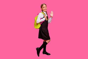 Full length body size view of her she nice attractive cheerful cheery confident diligent pre-teen girl back to school new academic year grade September isolated on bright vivid shine orange background © deagreez