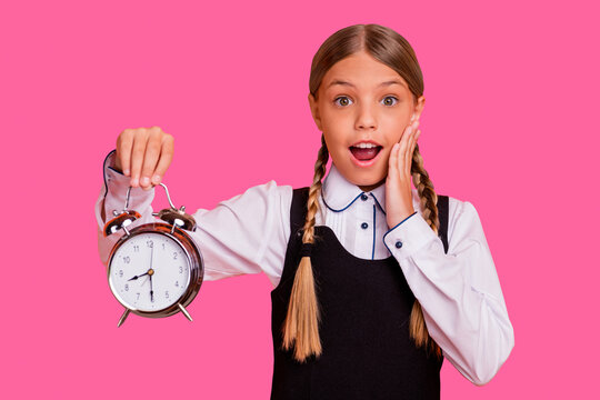 Close-up portrait of her she nice attractive lovely funny cheerful cheery glad pre-teen blonde girl holding in hand retro clock 1 September wakeup 