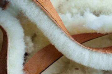 Macro shot of trimmed strips of tanned sheepskin with fluffy fleece © Silky Oaks