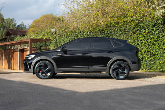 Black Volkswagen Nivus GTS Compact Crossover SUV Side Profile View Outdoors