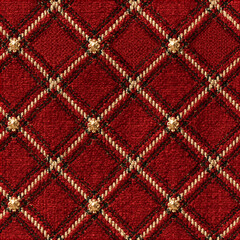 Obraz premium Seamless pattern red fabric texture forming a quilted diamond pattern, featuring woven ropes and ornate gold buttons at intersections, conveying luxury