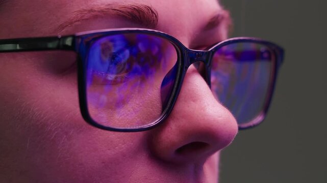 AI code on eyeglass glass, reflection on woman developer eyeglasses, working in dark office, tired busy people, depression on work, haker or it engineer with laptop, stocks markets. 