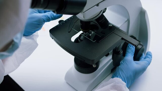 Engineer doctor working with microscope in laboratory, Scientific laboratory with various research equipment, man conducting experiments and research, Science and technology concept.