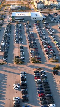 Automotive distribution center with cars lined up for sale and delivery, illustrating logistics, transportation networks and large-scale car inventory management.