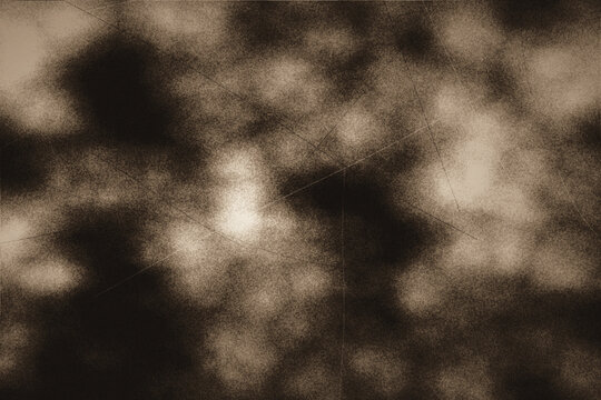 Sepia monochrome vintage grunge texture with soft clouds and subtle crossed scratches for abstract backdrop design and creative multimedia projects.