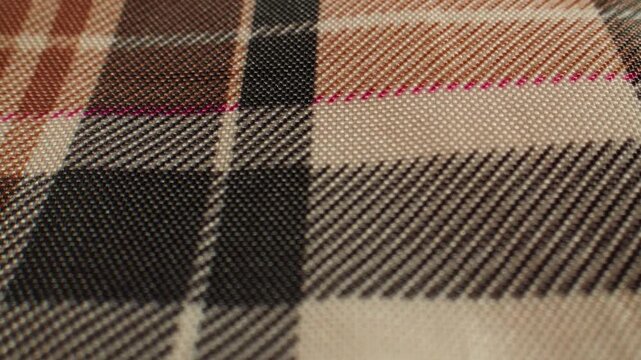 Plaid shirt fabric texture, checkered tartan textile extreme close up macro, cloth background for sewing, tailoring and clothing factory