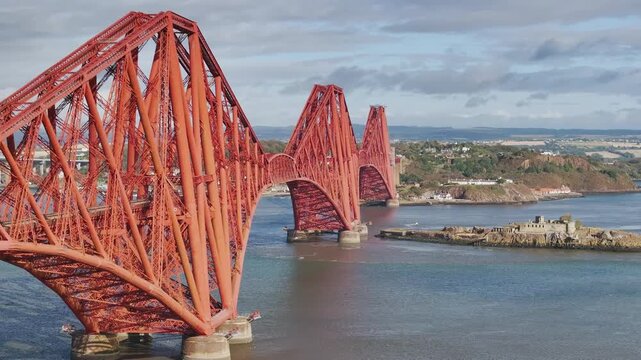 Trains on Forth Bridge from a drone, Queensferry Crossing, Forth Estuary, Scotland, United Kingdom