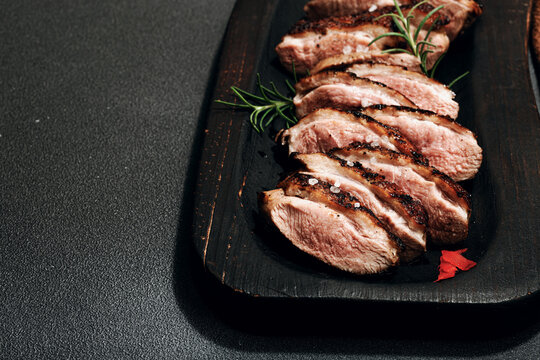 Fried duck breast with fresh orange and ginger, ready to eat food. Domestic cuisine, poultry meat