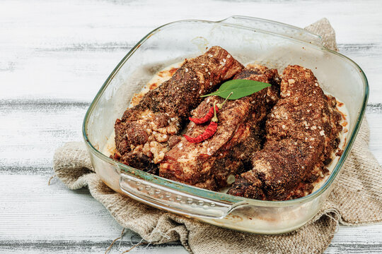 Baked pork ribs with spices, cold fat. Traditional ingredient for BBQ, picnic concept