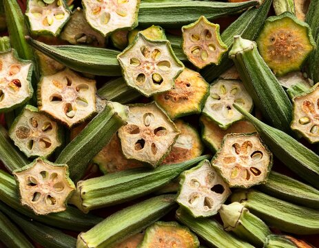 full frame background of dried okra chips and sliced dehydrated vegetable crisps for healthy snack