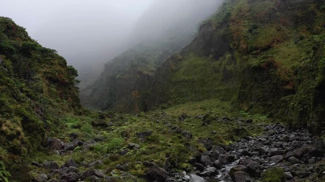 Drone shot, fog-covered wild and romantic valley Vale das Lombadas, Serra de Aqua de Pau, Sao Miguel Island, Azores, Portugal