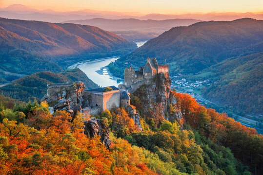 Beautiful landscape with Aggstein castle ruin and Danube River at sunset in Wachau valley Austria.