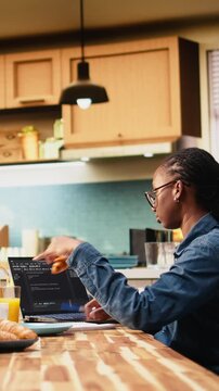 Vertical video: Adult woman writes programming code and develops software on laptop, debugging scripts, analyzing data and working with terminal window in digital work.