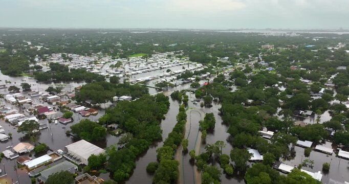 Hurricane Debby tropical rainstorm flooded residential homes in suburban community in Sarasota, Florida. Aftermath of natural disaster.