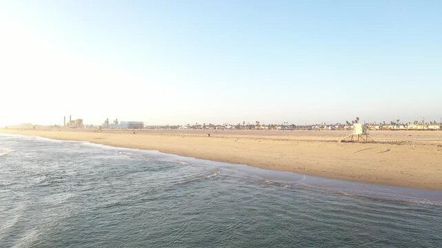 Aerial shoreline with lifeguard tower in Huntington Beach California