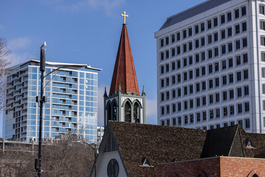 Daytime view of a church and skyline of downtown San Jose, California, USA.