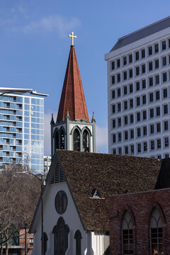 Daytime view of a church and skyline of downtown San Jose, California, USA.