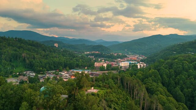 Rustic cottages and upscale mountain residences surrounded by forest canopy and dramatic landscapes in a serene countryside setting