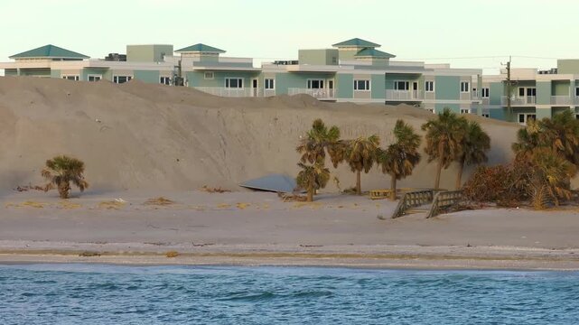 Sand piles after hurricane Milton at Englewood Beach on Manasota Key. Sand recipient site after storm surge as aftermath cleanup effort.