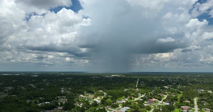 Stormy clouds forming during thunderstorm on dark sky.