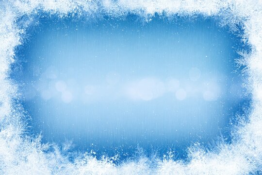 Frosty white ice crystals frame a soft blue, bokeh-filled winter background