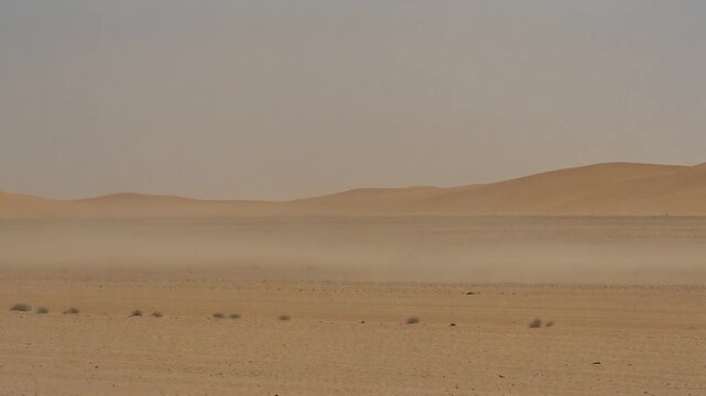 Dust storm moving across open desert