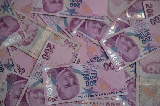 Colorful banknotes scattered on a table create an eye-catching display currency