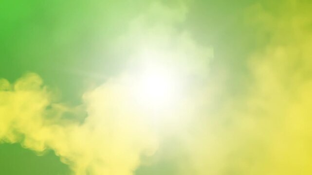 Bright yellow and green abstract background with glowing sun and soft smoke effects for design