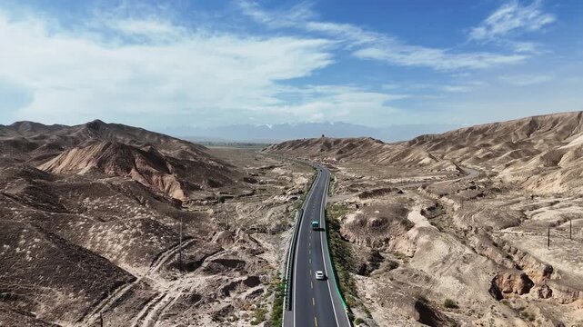 tower type concentrated solar power plant traversing desert canyon highway