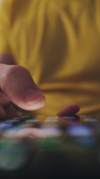 Looped Scene, Man Scrolling To Find An Application On Smartphone Screen At Home, Vertical Video